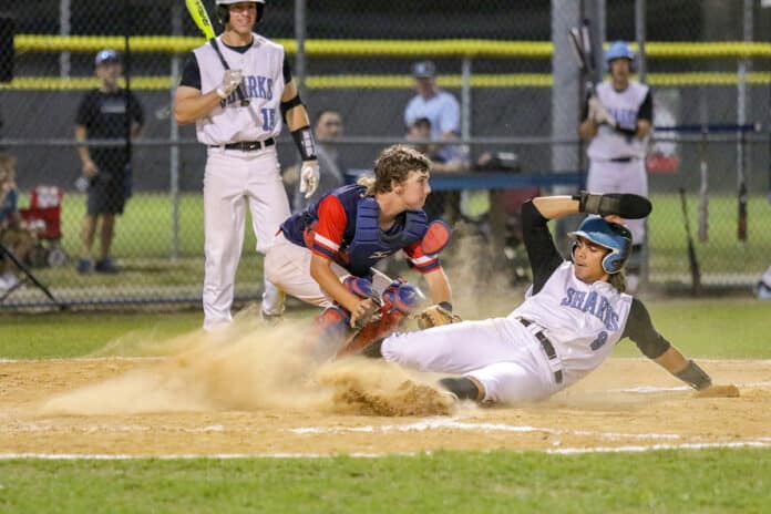 NCT Zach Funkhouser gets tagged by Taylor's Shane Phillips while sliding into home during the 2018 FHSAA Regional Quaterfinals at Nature Coast Tech Tuesday Night. Photo by Alice Mary Herden
