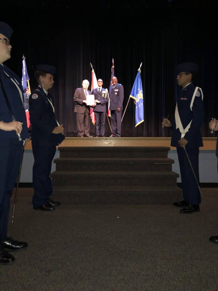 From L to R: Lt Col Dennis Foley, USAFR (ret) presents the Air Force Association Award for student cadet excellence to Cadet Josh Henriques.