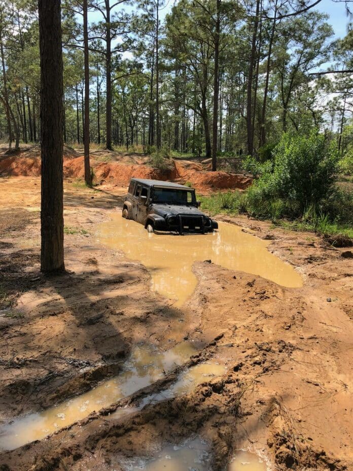 The Knipple family's Jeep stuck in the mud of the Citrus WMA.