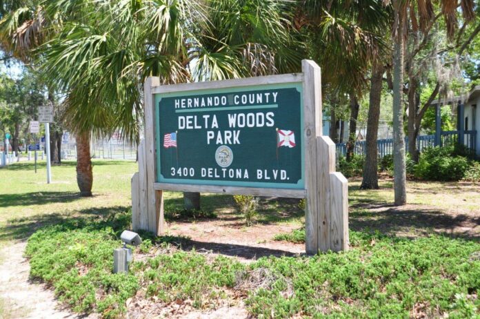 The Delta Woods Park Welcome Sign