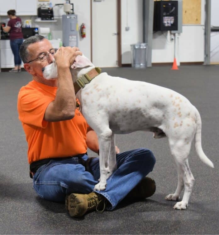 Paul and his service dog, Hans bond at K9 Partners for Patriots in Brooksville.