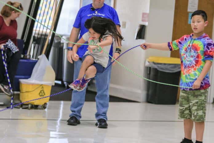 Just having fun. Brother and sister, Olivia  (9) and John (10) Helminski participate in the Double Dutch Club.