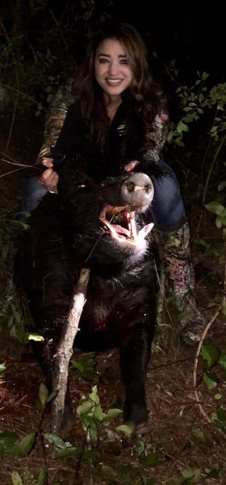 Rebecca Spradley with a monster boar hog taken after the sun went down!