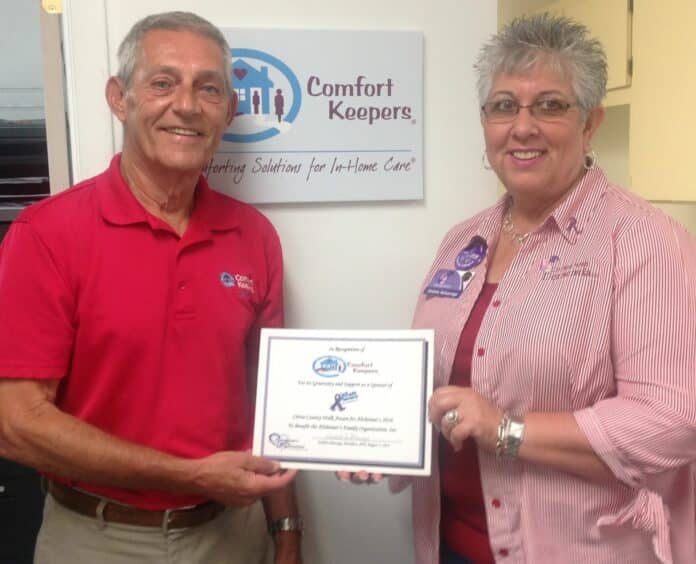 Gailen Spinka, Owner/Manager of Comfort Keepers in Citrus and Hernando counties, receives a certificate of recognition for his company’s support of Citrus County Walk Aware for Alzheimer’s from Debbie Selsavage, President of the Board of the Alzheimer’s Family Organization.