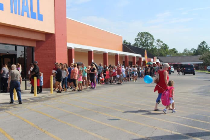 A line extends outside of Towne Square Mall in Spring Hill for Operation Backpack