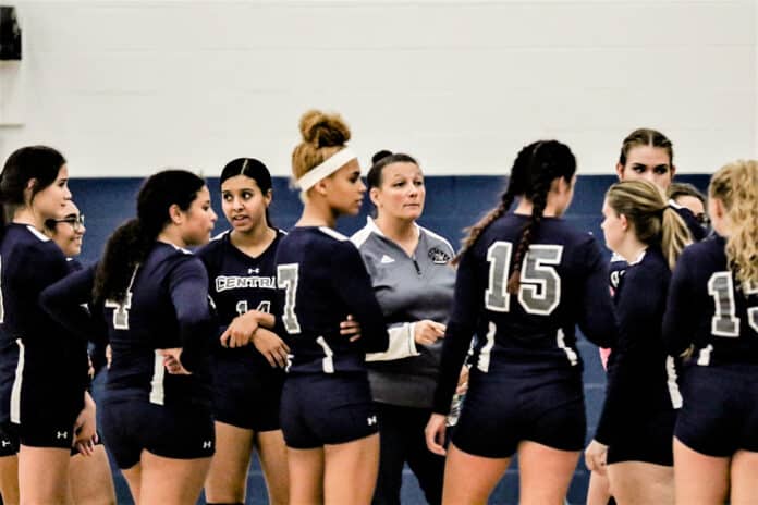 Coach Nikki LaRiviere speaks to her team.