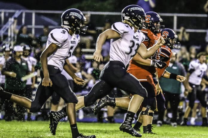 Hornets’ Captain Trenton Pisarski No. 33 and No. 5 Perry Nation running on coverage against Springstead.