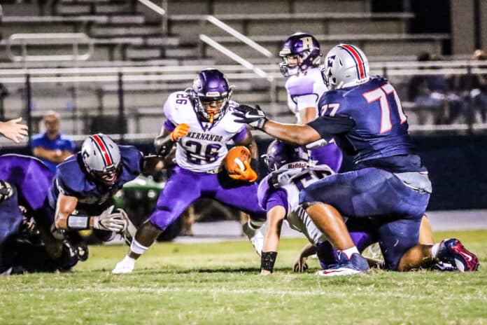 Leopards’ No. 26 Isreal Fields dodges a tackle in game against Hudson Fivay during Week 2 of regular season. 