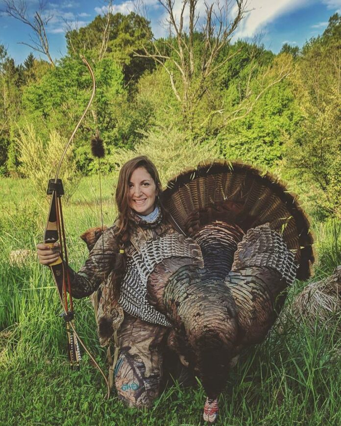 Photo of  One of Toby's hunting buddies, Beka Garris with a handsome fall turkey taken with a traditional recurve bow