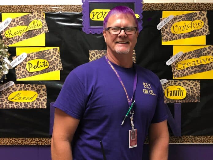 Photo of principal Brent Gaustad with purple hair