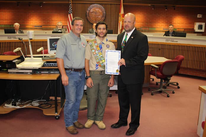 TOP:  (From L to R) Hernando County Fire Rescue Logistics Manager (and father of Kyle Walker) John Walker, Eagle Scout Kyle Walker and Commissioner Jeff Holcomb; RIGHT: Picnic shelter constructed by Kyle Walker
