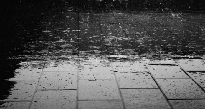 Photo of rain on brick surface