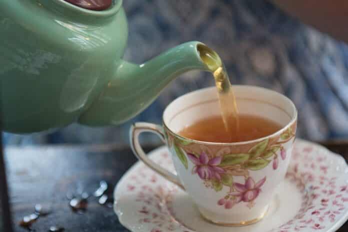 Tea being poured into a cup