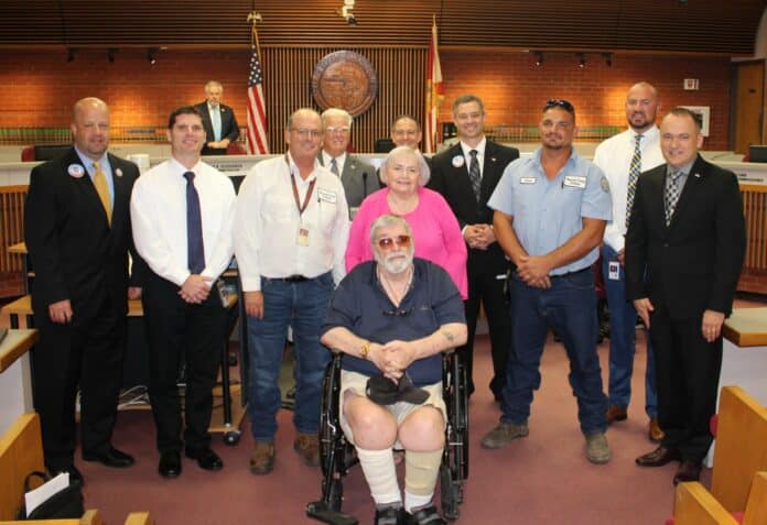 Ret. Lt. Col. David Keith, center, surrounded by Hernando County Utilities Department staff and Hernando County Board of County Commissioners. CREDIT: Hernando Co. Gov