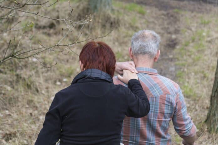 Caregiver attends to loved one