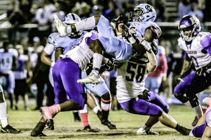 Leopards get in some good hits. Friday night HHS defense stops NCT #6 Shemar Lawson. Photo by Cheryl Clanton