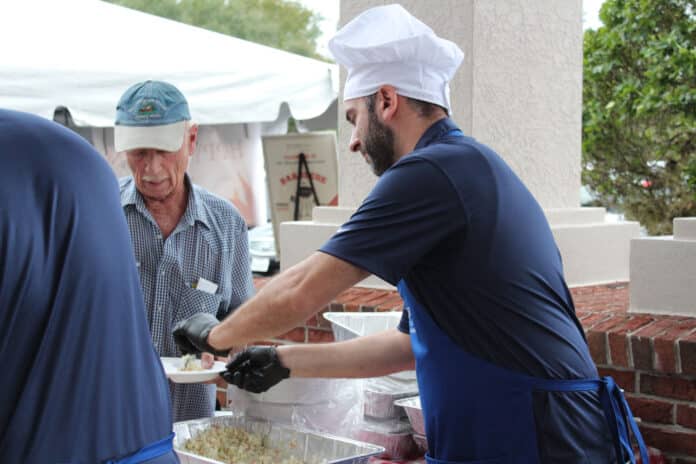 Dr. Ayman Barakat, right, tempting his patients with some dishes. 