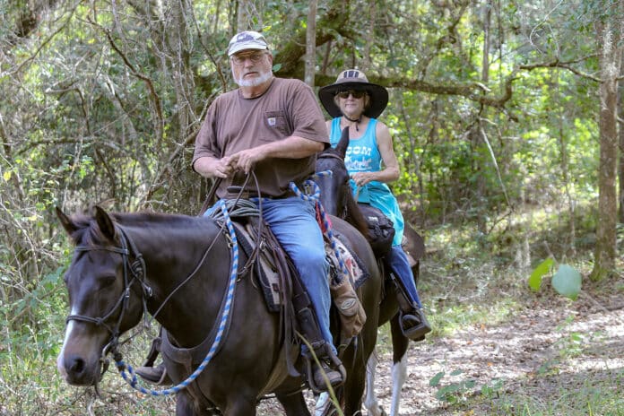 Lee Adams from Sumter County and Dana Proeger from Brooksville ride the trails at Tucker Hill, a trail head of the Withlacoochee State Forest