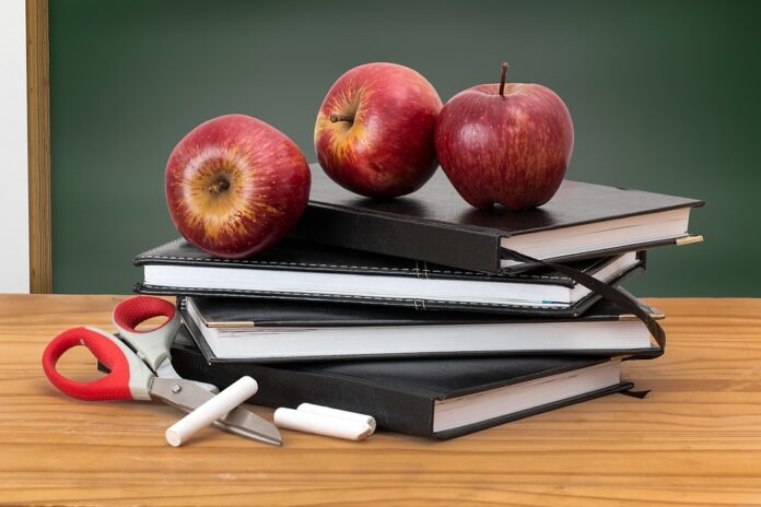 Image of apples, books and school supplies