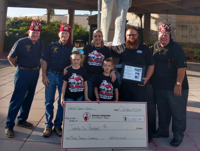 Above: Shriner members with the Joyner Family, owners of United Speed World in Tampa.  United Speed World donated the proceeds of a car show cruise in ($26,000) to Shriners Hospital for Children in Tampa for a Motion Analysis Laboratory to treat Spina Bifida.