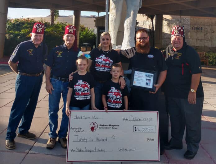 Above: Shriner members with the Joyner Family, owners of United Speed World in Tampa.  United Speed World donated the proceeds of a car show cruise in ($26,000) to Shriners Hospital for Children in Tampa for a Motion Analysis Laboratory to treat Spina Bifida. 