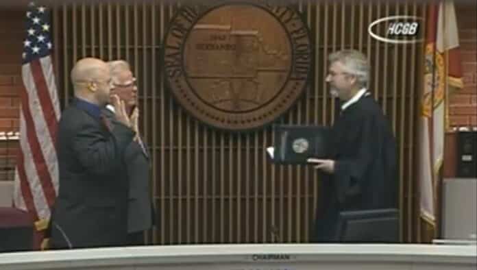 Commissioner Wayne Dukes and Commissioner Jeff Holcomb are sworn in by Judge Merritt.