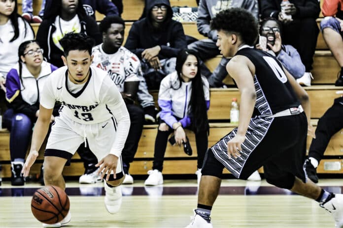 Centrals senior #13 Vince Valencia dribbling around and through Sharks on his way to making a two-pointer for the Bears, Friday night Jan. 25, 2019.