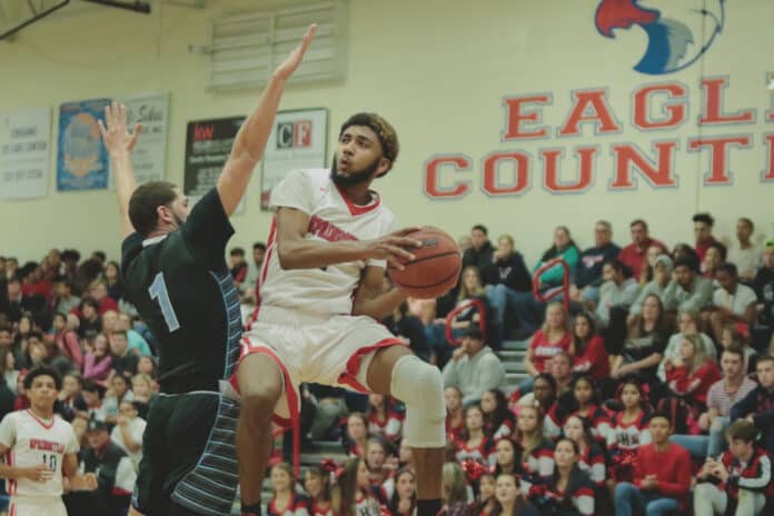 Eagles Unique Torain attempts a shot against Nature Coast's Robert Gomez