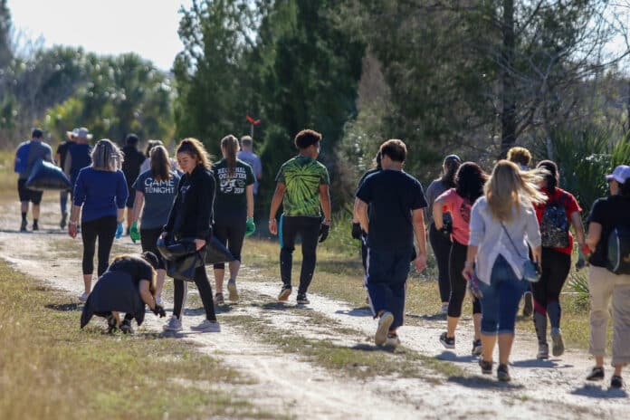Students from both Weeki Wachee High School and Hernando High School joined together to help pick up trash at Weekiwachee Preserve in Spring Hill.