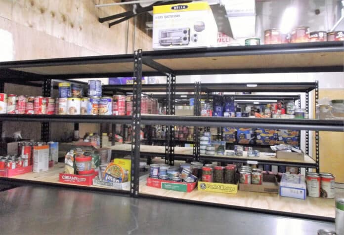 Storage shelves with food supplies at the PHP Help Center, Kass Circle in Spring Hill