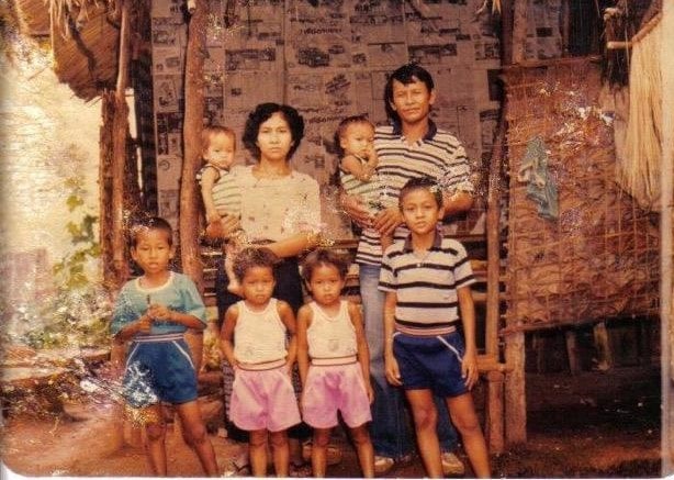 Steven and his family at the refugee camp in Thailand. Photo courtesy of Nammontry family.