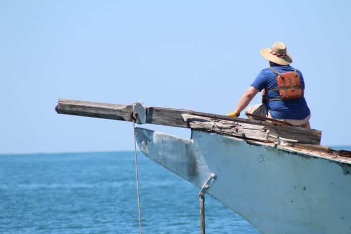 Captain Tim Mullane on the bow of the Ghost Ship