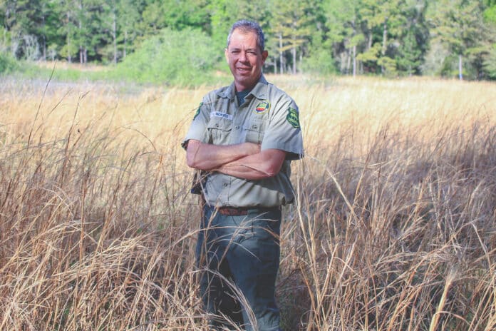 Vince Morris standing near the edge of the Twin Pond basin.