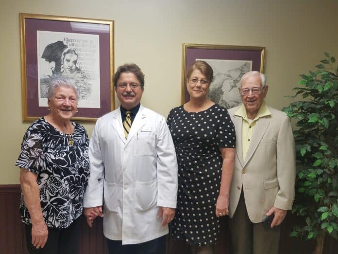From left to right: Delia Gagliardi, Dr. Brian Roebuck and his Office Manager of 25 years, Becky, Emil Vogler.