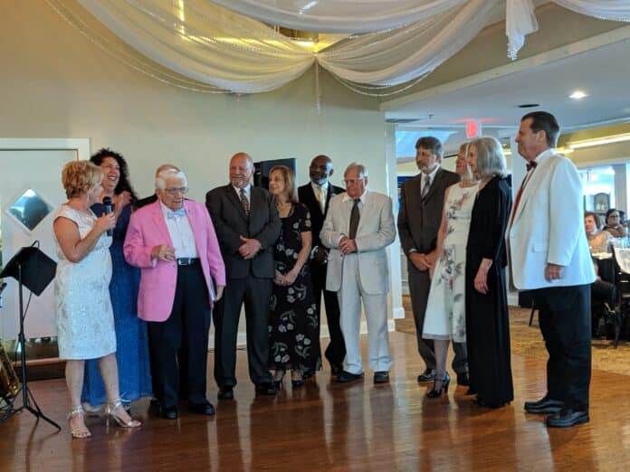 Debbie, far left, addresses the Enrichment Center Board of Directors and says farewell during the Senior Prom on May 23, 2019.