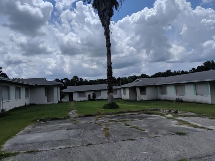 Homes in Hillside Estates remain boarded up.