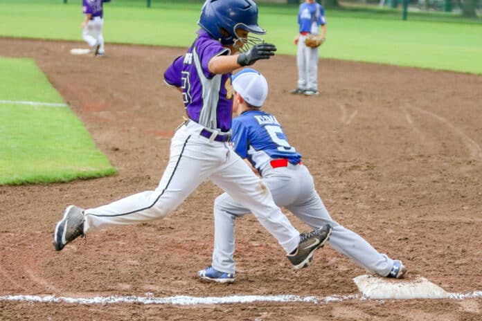 -Machine Pitch- Brooksville vs Wildwood 2: Brooksville Troy Helad attempts to make it to first base during the Dixie Youth Baseball Machine Pitch District Tournament being held at the San Antonio Athletic Complex. 