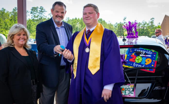 Stephen Manley handing the keys to Corbin Beller