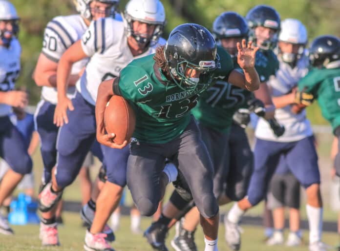 Weeki Wachee Senior David Richards recovers in an offense push through Calvary’s defense during a spring scrimmage game. Photo by Alice Mary Herden.