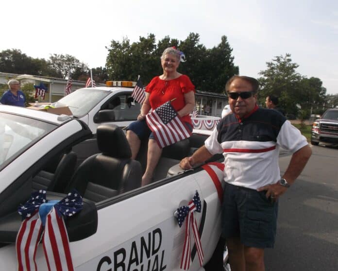 Parade Grand Marshal Gwen Roy and her driver, Ron Bridgeman