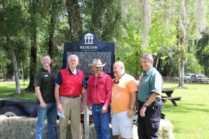 Eric Burkes (center) and his wife Donna Burkes sponsored the 1st and 2nd historic markers at Richloam.  They operate the Richloam General Store.  From left to right: Commissioner John Allocco, US Congressman Daniel Webster, Eric Burkes, Clerk of Court and Comptroller Doug Chorvat Jr. and Sheriff Al Nienhuis at the second historic marker unveiling on Saturday June 29, 2019.