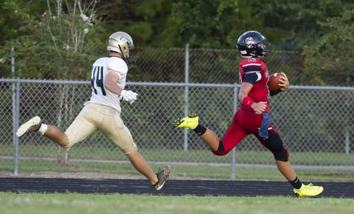 Springstead QB Max O’Rourke scores the first Eagle TD of the season against Sunlake.  Photo by JOE DiCRISTOFALO