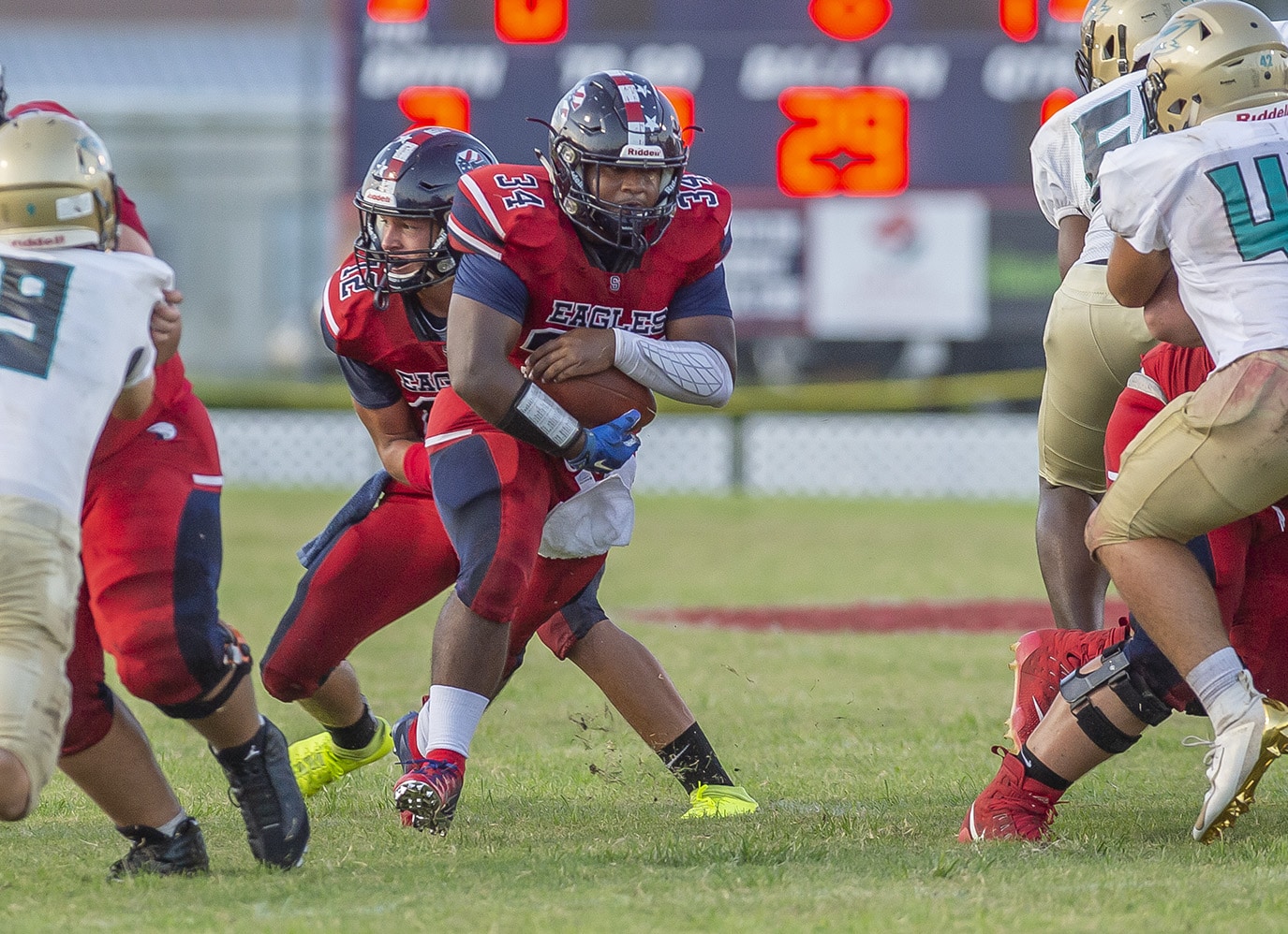 Toby Rahman, 34, finds room through the middle of the Sunlake defense Friday at Booster Stadium.  Photo by JOE DiCRISTOFALO