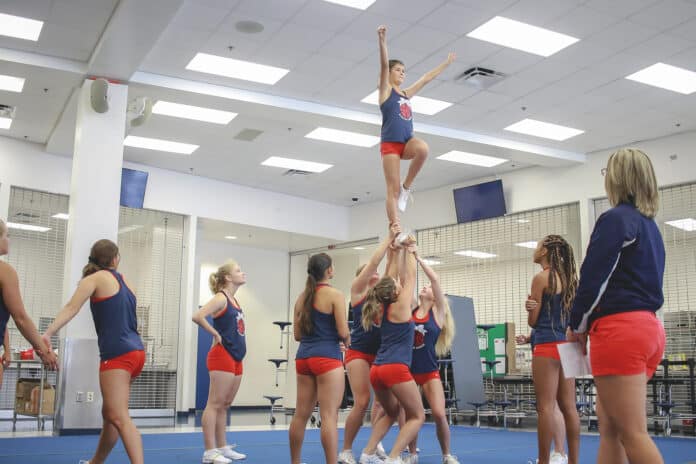 Fall Preview_ Springstead Cheerleading: “What we do on this mat it’s important to pay attention. The littlest things can happen and cause injury for life,” Springstead cheerleading coach Shannon Herod said during practice in the Springstead High cafeteria.