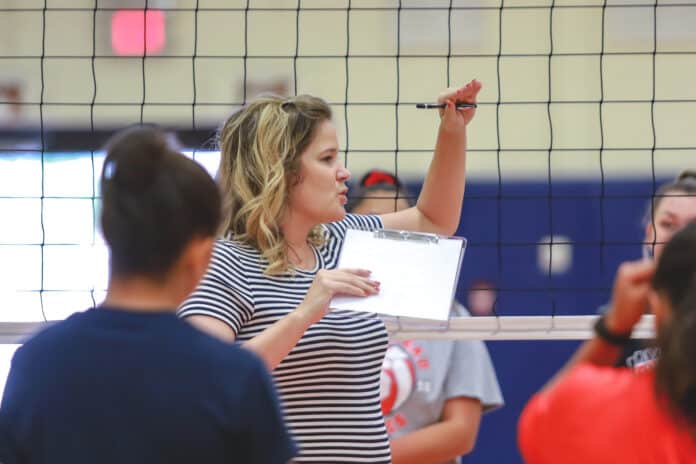 Springstead Volleyball:  Varsity Volleyball Coach Andrea Kneser explains to the student-athletes the specific drills they will be conducting during the volleyball workouts. “I am going to bring my volleyball knowledge into this program and build off their athleticism,” said Kneser.