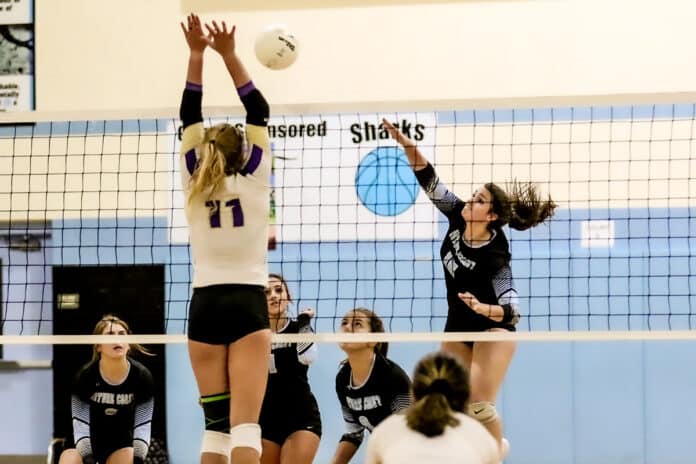 Nature Coast Powerhouse player #15 Izzy Traudt kills the ball against Hernando Leopards #11 Olivia Balogh Tuesday night Aug. 20, 2019 girls volleyball game.