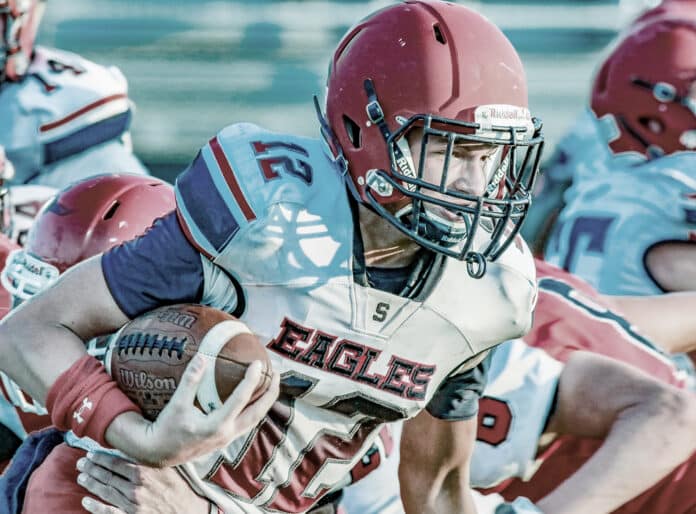 Spring Football 2019: Senior Max O'rourke, quarterback for Springstead, pushes his way through Dunnellon High Tigers defense in attempts for a first down. 