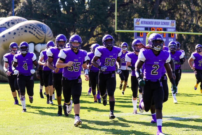 HHS varsity football team takes the field