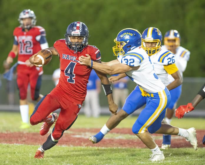 Springstead High’s Anthony Alexis (4) tries to elude a tackle in the game against Crystal River. Alexis scored one of three Eagle touchdowns. Photo by JOE DiCRISTOFALO