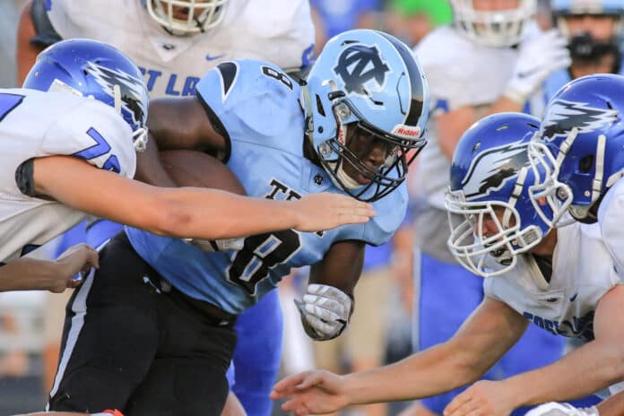 NCT Junior Kinyatah Morgan makes his way through East Lake’s defense for a first down.